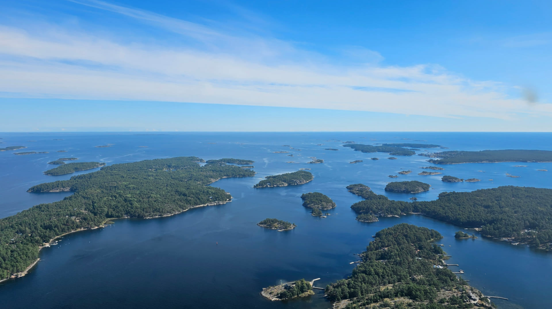 The Stockholm archipelago with islands, skerries and open sea seen from a helicopter